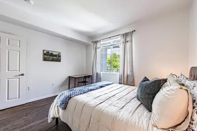 a bedroom with a bed and a window at Modern Townhouse with 4 Bedrooms Near LAX in Los Angeles