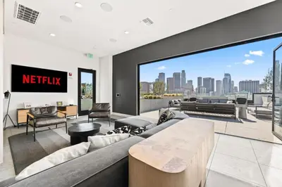 a living room with a couch and a view of the city at Modern Living, Stunning city views, 1Mile to Dodger Stadium in Los Angeles