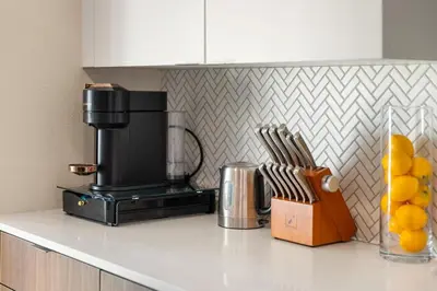 a kitchen counter with a blender on a counter top at Jade Breeze - Elegant 2BR near Water Outstanding Amenities in Los Angeles