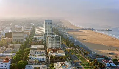 an aerial view of a city with a beach and buildings at 2BR Condo in Santa Monica - Walking Distance to Beach, Dining, Shopping & Promenade in Los Angeles