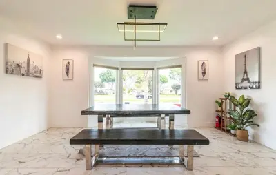 a dining room with a table and a large window at Luxe Stay Room with Private Bathroom 55 in Los Angeles