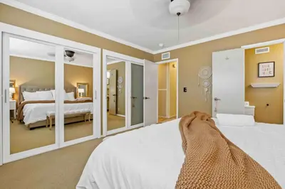 a dog laying on a bed in a bedroom at The 3BR-2BA Extended Stay Oasis in Anaheim in Anaheim