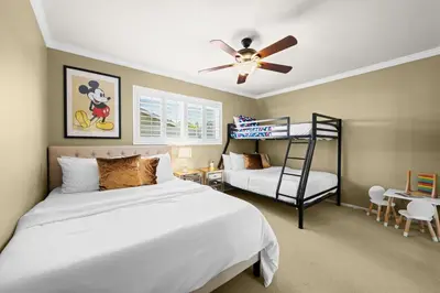 a bedroom with a bed and a bunk bed at The 3BR-2BA Extended Stay Oasis in Anaheim in Anaheim