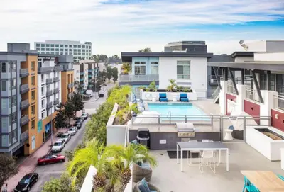 an apartment balcony with a pool and buildings at Sunset Duo 2 bedroom Charm with FREE Parking in Los Angeles