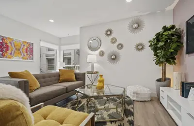 a living room with a couch and a table at Sunset Duo 2 bedroom Charm with FREE Parking in Los Angeles