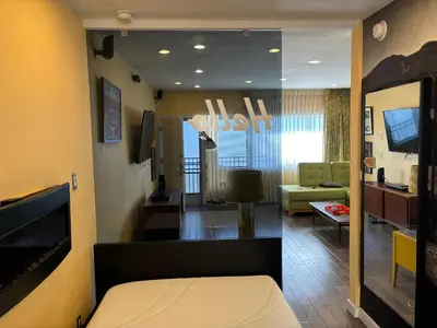 a room with a room with a living room at west hollywood condo in Los Angeles