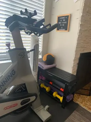 a hair dryer and a chair in a room at Sunny Retro Row Condo- Walk to Beach! in Long Beach