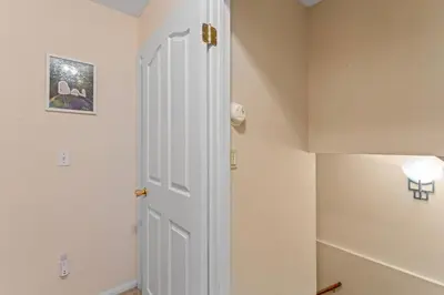 a white door in a room with a lamp at Casa de Yukon & Black stone Grill, 3 Level Home in Lake Arrowhead