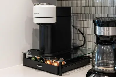 a coffee maker sitting on top of a counter at Spinel Stay - Charming 2BR Retreat Zen Garden Views Central in Los Angeles