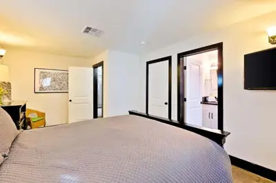 a bedroom with a bed and a tv on the wall at Peaceful Retreat in Anaheim-close to Disney in Anaheim