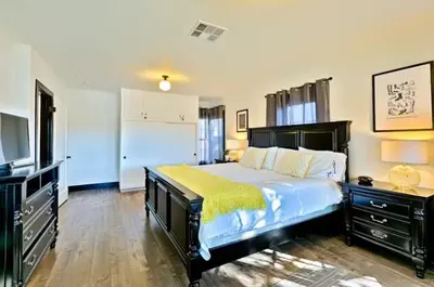 a bedroom with a large bed and a television at Peaceful Retreat in Anaheim-close to Disney in Anaheim