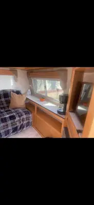 a small room with a bed and a window at Cozy private couples camper in San Gabriel CA in San Gabriel