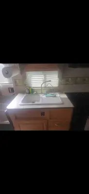 a small kitchen with a sink and a window at Cozy private couples camper in San Gabriel CA in San Gabriel