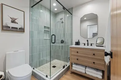 a bathroom with a shower with a toilet and a sink at The Oaks, Stylish Luxury Stay, Fire Pit & Patio in Thousand Oaks