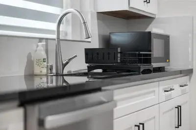 a kitchen with a laptop computer on a counter at Cozy 3BR in San Gabriel in San Gabriel