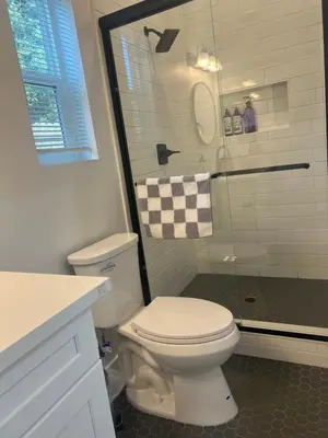 a bathroom with a white toilet and a shower at Comfy & calm rooms near I-10, Temple city in Temple City