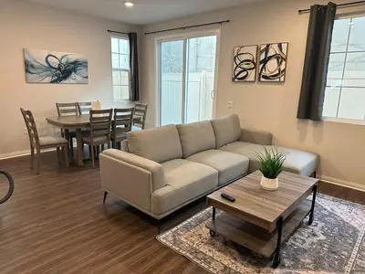 a living room with a couch and a table at Gated Upland Home 3b 3 bath in Upland