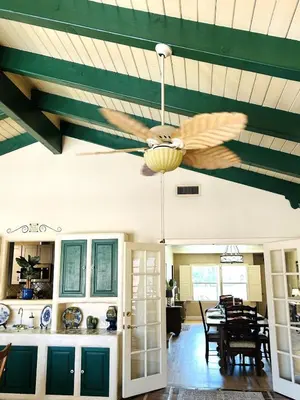 a kitchen and dining room with a ceiling fan at UNIQUE SPANISH HACIENDA HOUSE with POOL VINTAGE 1948 EUROPEAN ANTIQUES ETHNIC ART in Bakersfield