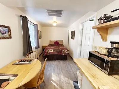 a small room with a table and a bed at Pine Knot Guest Ranch in Big Bear Lake