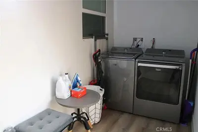 a small kitchen with a sink and a dishwasher at Single family house in Long Beach