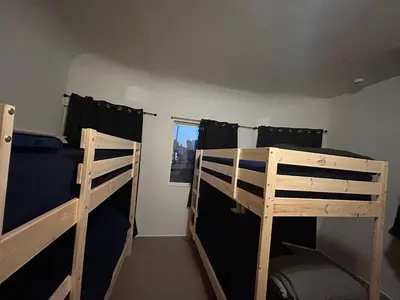 a bedroom with two bunk beds and a window at Los Angeles Cozy Vibe in Los Angeles