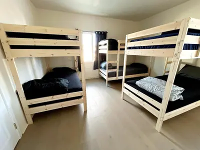 a room with four bunk beds in a room at Los Angeles Cozy Vibe in Los Angeles