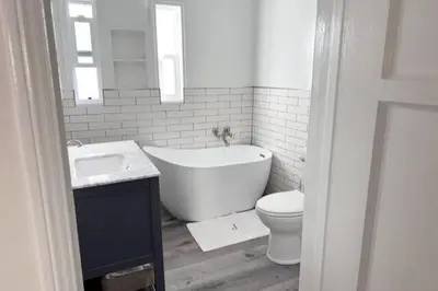 a bathroom with a tub and a toilet and a sink at Fully remodeled 1 bedroom in prime West Hollywood in Los Angeles