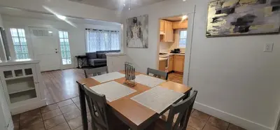 a dining room and kitchen with a table and chairs at Private 3 bedroom Home in Los Angeles - Gardena, California in Gardena