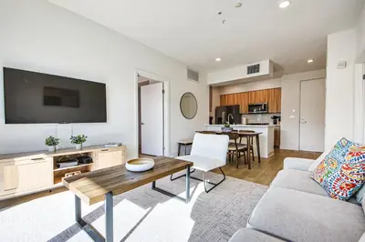 a living room with a couch and a table at Beachside 2BD 2BA, 12Min Walk to Santa Monica Pier in Los Angeles