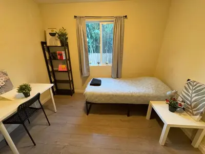 a small room with a bed and a window at Blue Private Room near BMO Stadium USC and K-Town in Los Angeles