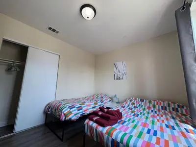 a bedroom with a bed and a mirror at Blue Private Room near BMO Stadium USC and K-Town in Los Angeles