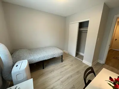 a small bedroom with a bed and a table at Blue Stay near BMO Stadium and USC Private Room in Los Angeles