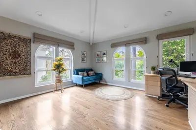 an office with a desk and a chair and windows at Tranquil family beach city retreat in Redondo Beach