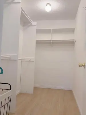 an empty room with white walls and wooden floors at 1b1b Private and quiet sun roomA in Rancho Cucamonga