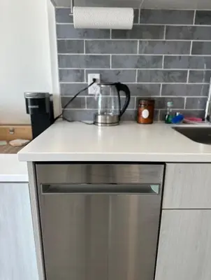 a kitchen counter with a appliance on top of it at Heart of Hollywood-Walk of Fame 1bd Studio with View -Free parking, balcony, wifi, rooftop, gym, upscale amenities in Los Angeles