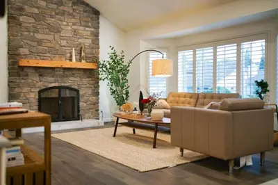 a living room with a couch and a fireplace at Luxe Sundance Villa 3BR with Pool and Spa Near Disney in Pomona