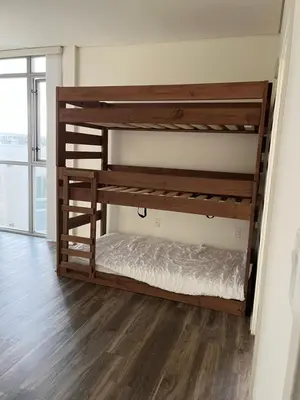 a bunk bed in a room with wooden bunk beds at HollywoodNorth in Los Angeles