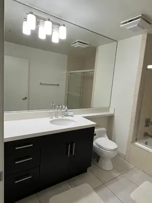 a bathroom with a sink and a toilet and a mirror at HollywoodNorth in Los Angeles