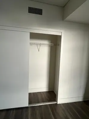 an empty room with a white wall and a closet at HollywoodNorth in Los Angeles