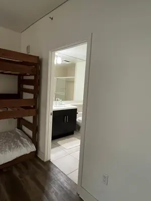 a bedroom with a bunk bed and a bathroom at NoHo in Los Angeles