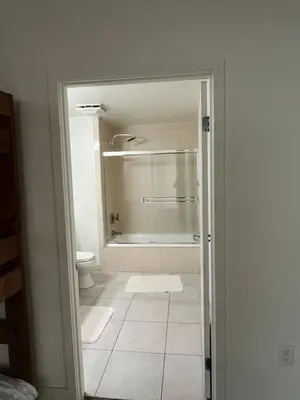 a bathroom with a shower and a tub and a toilet at NoHo in Los Angeles