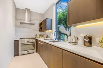 a kitchen with a sink and a window at Hutton Modern in Beverly Hills