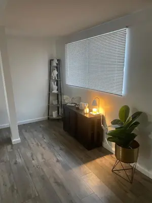 a room with a desk and a plant and a window at Sofi Intuit Forum Vacation Oasis in Los Angeles