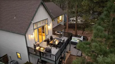 an aerial view of a house with a deck at NEW Serenity Lodge Base Of Snow Summit Hot Tub in Big Bear Lake