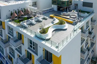 an aerial view of a building with a slide at Modern Hollywood Walk of Fame Apts- Free Parking, 360 Rooftop, Pool, Gym- Centrally located in Los Angeles