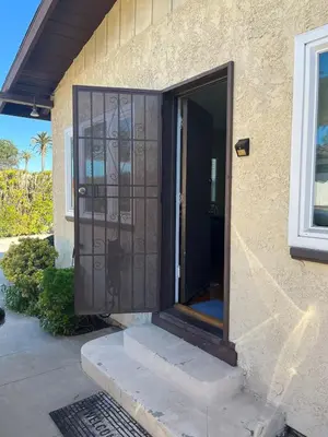 an open door of a house with a porch at Cozy One Bedroom Apartment in Los Angeles