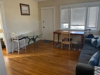 a living room with a table and a couch at Cozy One Bedroom Apartment in Los Angeles