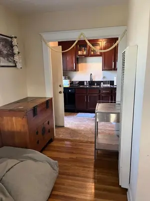 a room with a kitchen with a table and a counter at Cozy One Bedroom Apartment in Los Angeles