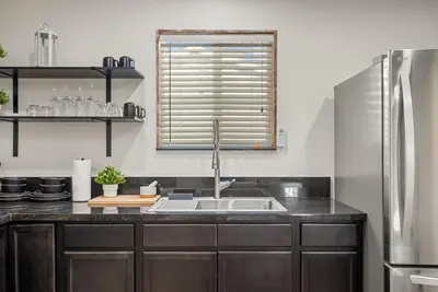 a kitchen counter with a sink and a window at Perfect 2BR Near Universal Studios By Poshguest in San Fernando