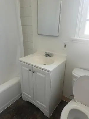 a white bathroom with a sink and a toilet at Best location of Hollywood, great room in 2bdrm apt, walk of fame in Los Angeles